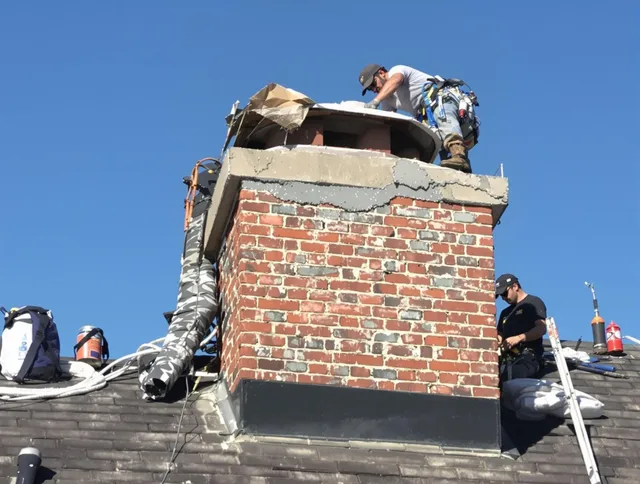 Plymouth Chimney Sweep installing a custom chimney crown in Plymouth, CT