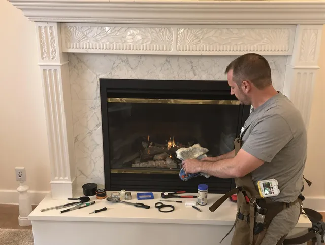 Plymouth Chimney Sweep performing fireplace maintenance in Plymouth, CT