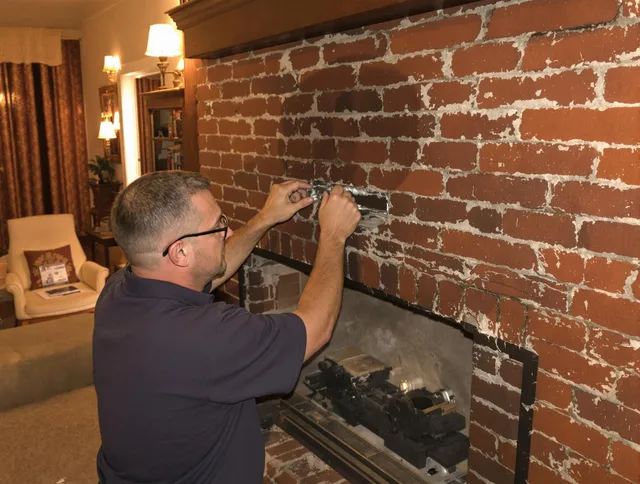 Plymouth Chimney Sweep expert fixing a fireplace in Plymouth, CT